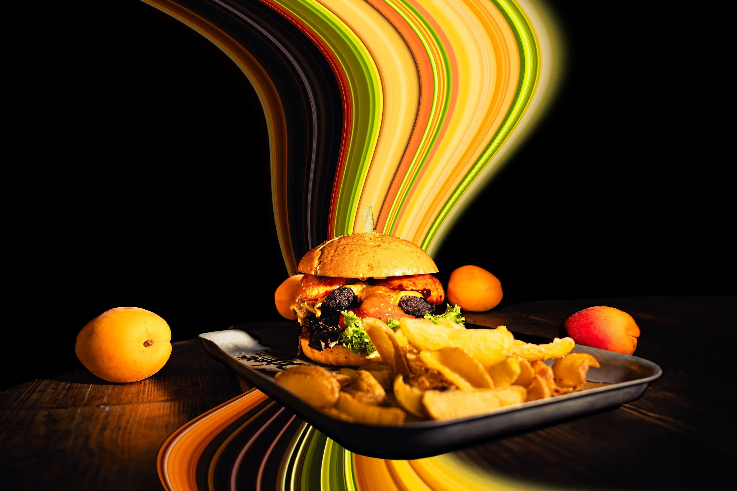 Burger with fries on a tray, colourful light trails behind